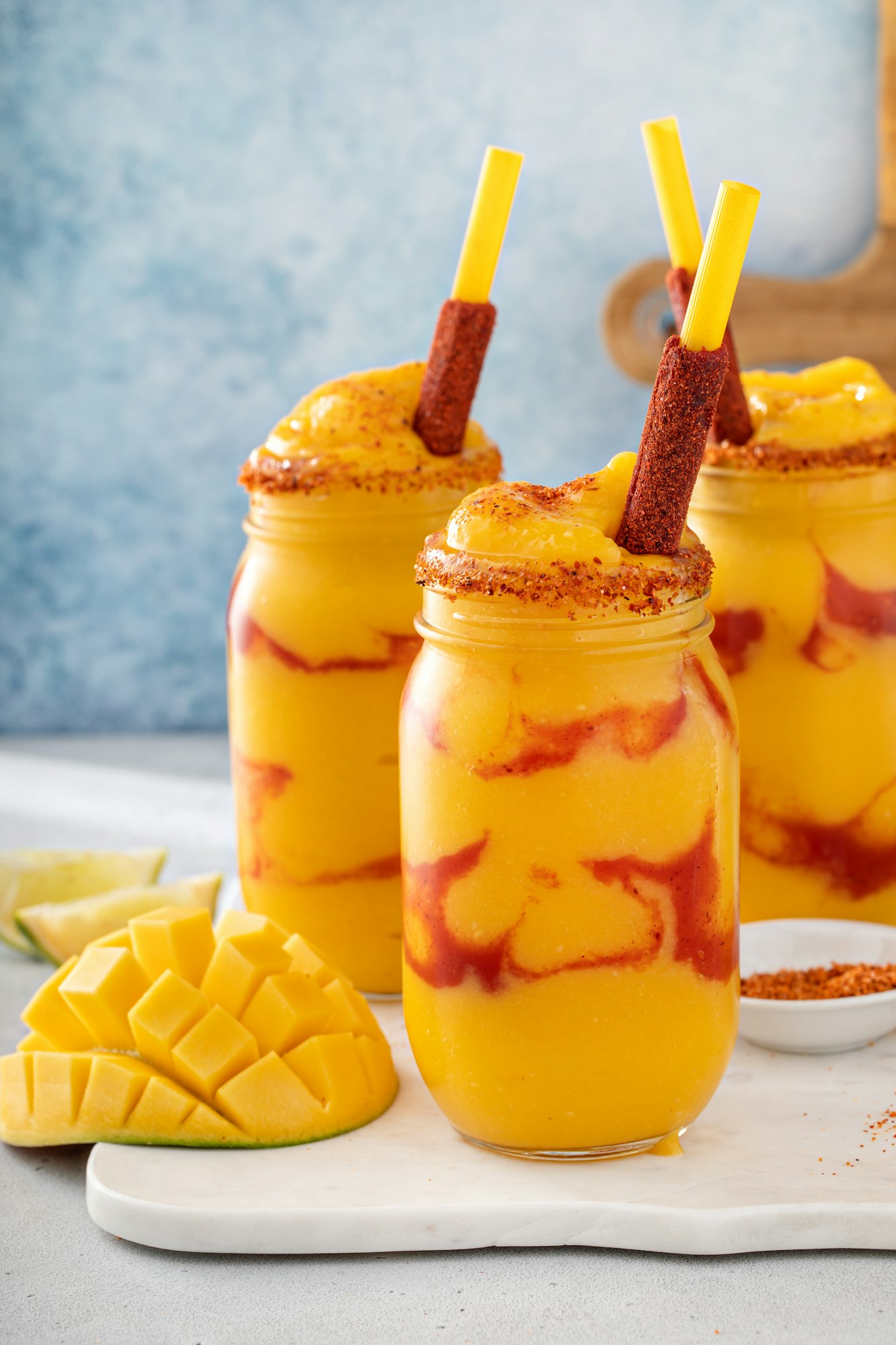 Mangonada mexican mango smoothie with chamoy sauce and lime seasoning